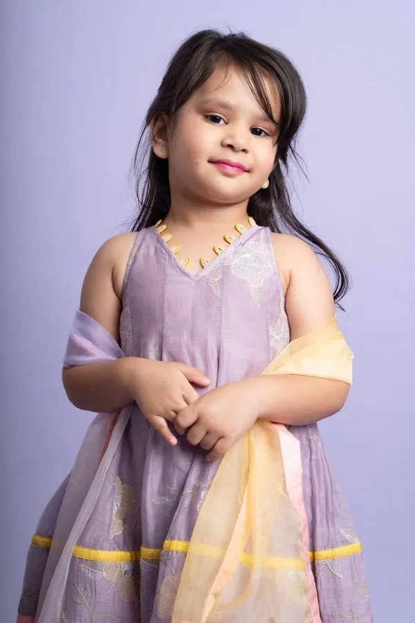 Adorable Lavender top with golden yellow dhoti pants and matching dupatta, perfect for festive celebrations