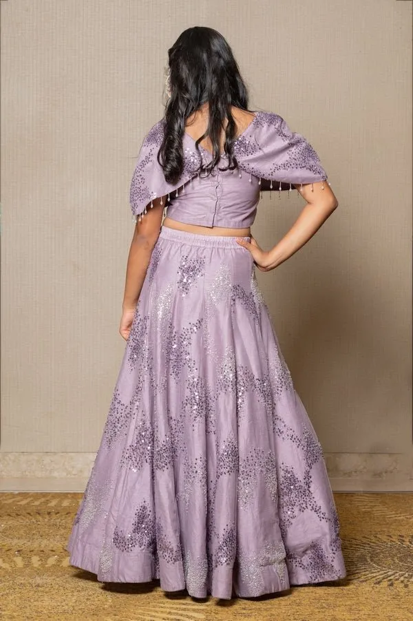 Stunning lilac ensemble with sequin embellishments and a flowing Lahenga, perfect for a graceful and elegant look at any special occasion.