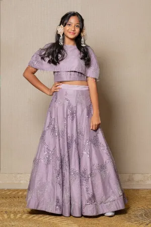 Stunning lilac ensemble with sequin embellishments and a flowing Lahenga, perfect for a graceful and elegant look at any special occasion.